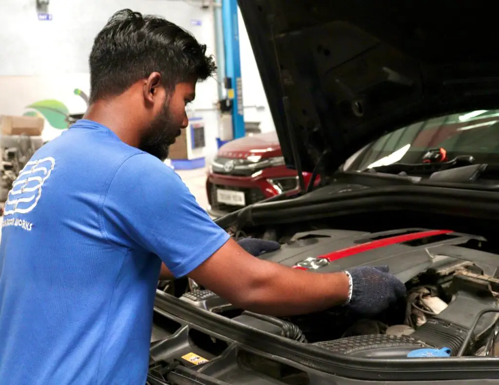 Basca Motors Gurgaon Mercedes Benz Luxury Workshop Technician Working on Mercedes Car Image 2